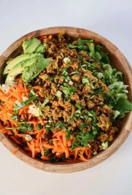 Healthy Egg Roll In A Bowl Salad featuring fresh veggies and lean proteins