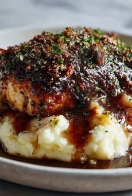 Deliciously cooked Garlic Herb Chicken garnished with fresh herbs.