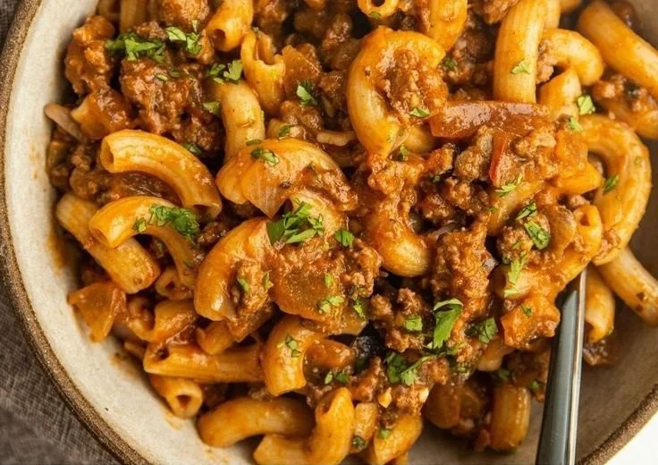 Bowl of gluten-free dairy-free Hamburger Helper with fresh ingredients.