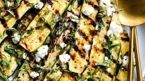Grilled zucchini topped with goat cheese, basil, and honey