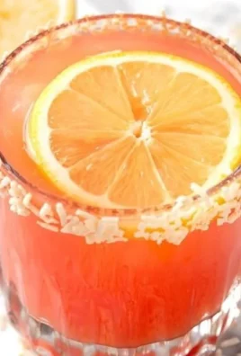Refreshing Guava Mocktail garnished with fruit slices