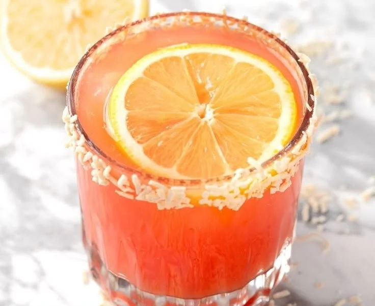 Refreshing Guava Mocktail garnished with fruit slices