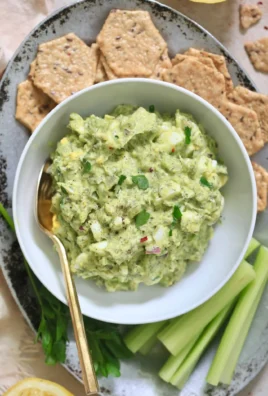 Herby avocado egg salad served in a bowl, perfect for a quick lunch.