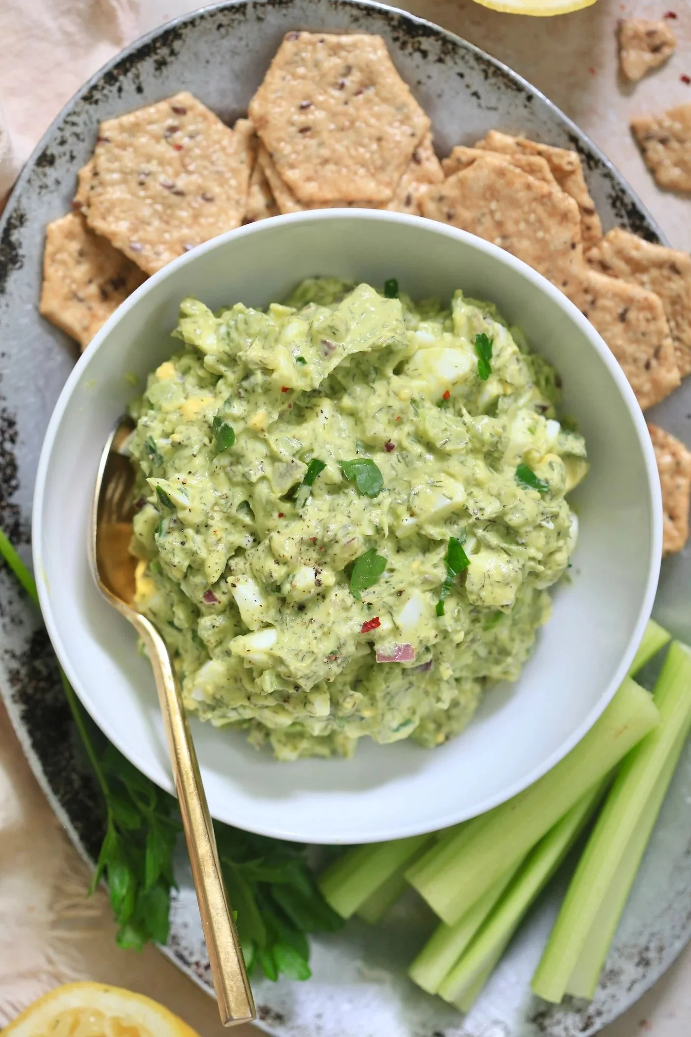 Herby avocado egg salad served in a bowl, perfect for a quick lunch.