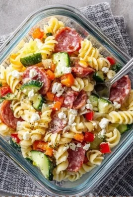 High-Protein Italian Pasta Salad with colorful vegetables and dressing