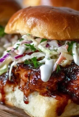 Honey Chipotle Garlic Chicken Sliders served with a side dish.