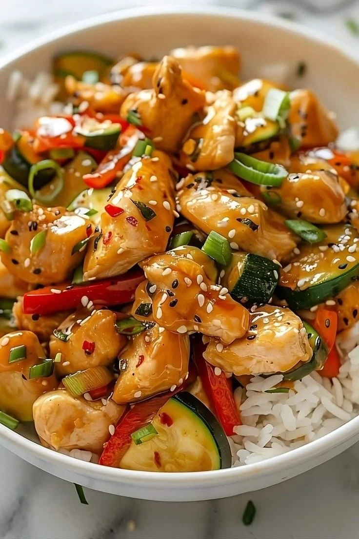 Delicious honey garlic chicken stir-fry in a colorful vegetable mix.