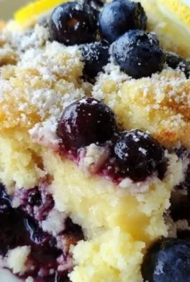 Lemon Blueberry Cheesecake Dump Cake topped with fresh blueberries
