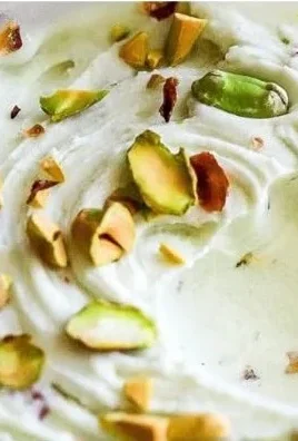 Delicious Ninja Creami Pistachio Ice Cream in a bowl with green pistachios