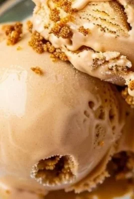 Ninja Creami Vanilla Protein Ice Cream in a bowl with a scoop on top