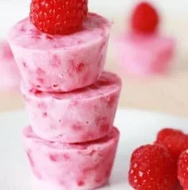 Delicious raspberry frozen yogurt bites in a bowl, perfect for a refreshing snack.