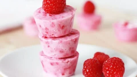 Delicious raspberry frozen yogurt bites in a bowl, perfect for a refreshing snack.