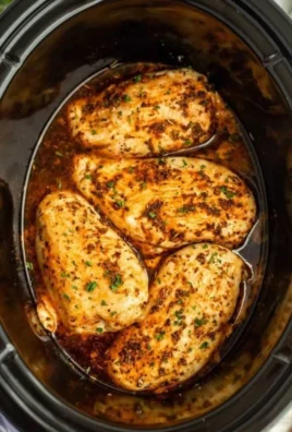 Delicious slow cooker chicken breasts cooked to perfection with herbs and spices.
