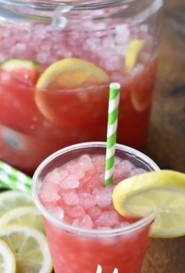 Sparkling watermelon lemonade served in a glass with fresh fruits