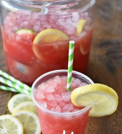 Sparkling watermelon lemonade served in a glass with fresh fruits
