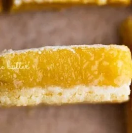 Delicious super easy lemon bars with a bright yellow filling and powdered sugar on top.
