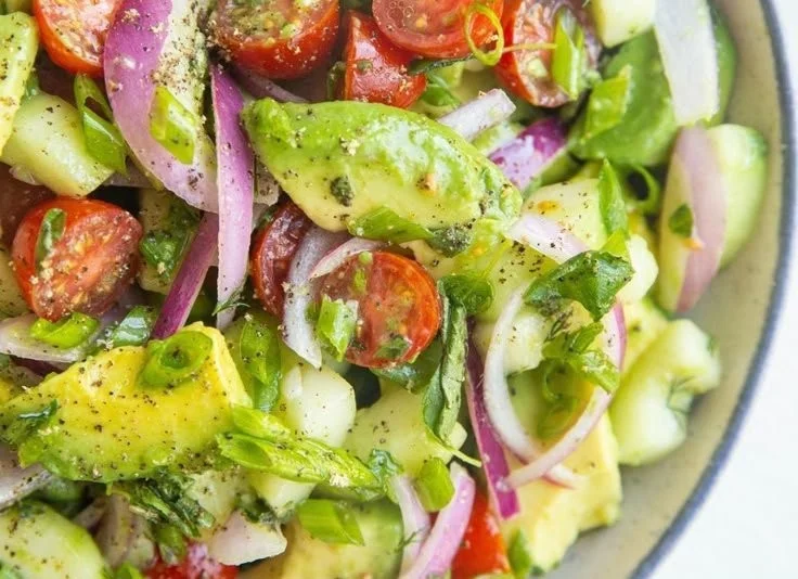 A vibrant avocado salad with fresh ingredients, ideal for healthy meals.