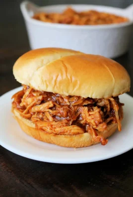 Delicious crockpot BBQ chicken served with sides, perfect for easy family dinners.