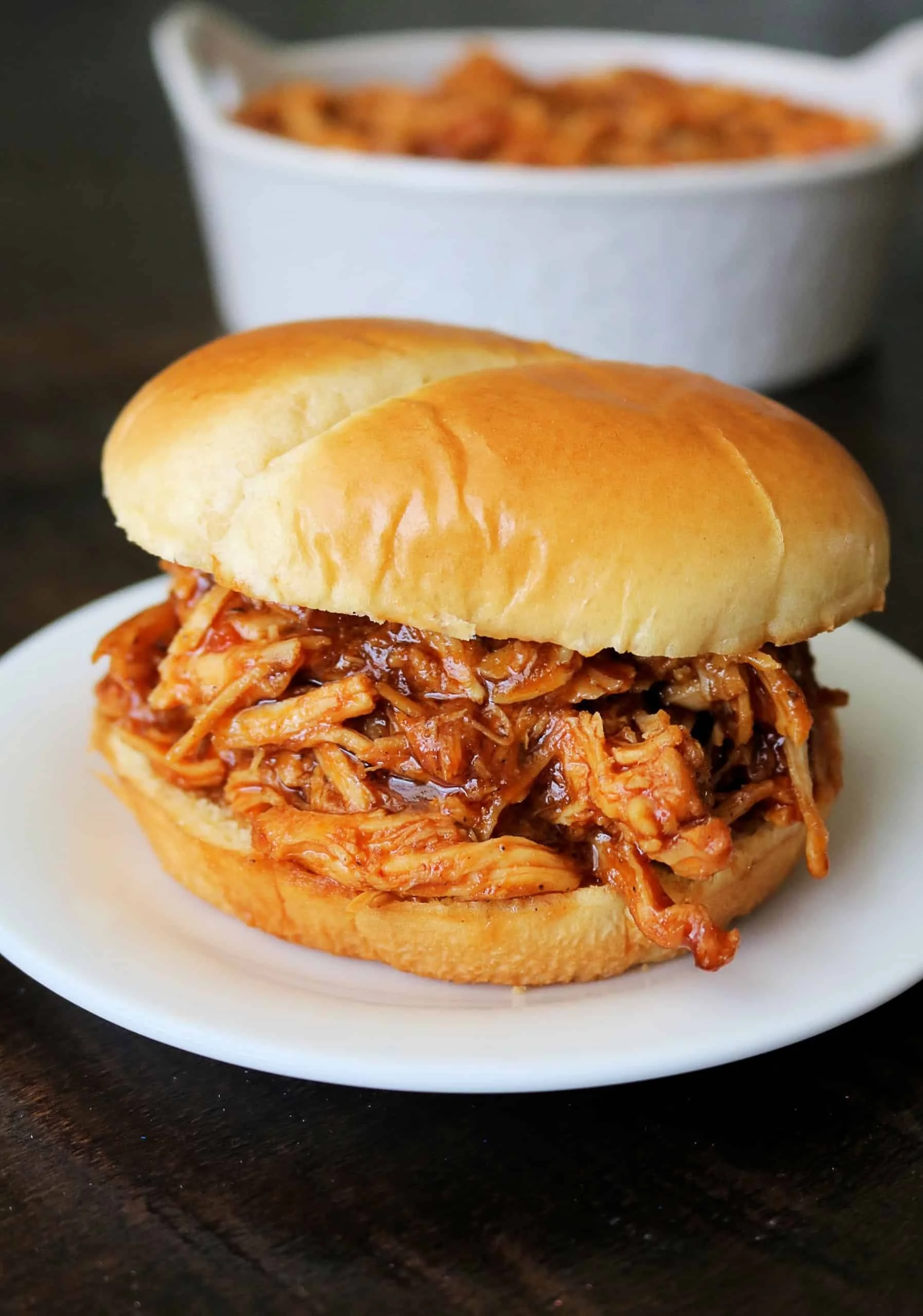 Delicious crockpot BBQ chicken served with sides, perfect for easy family dinners.