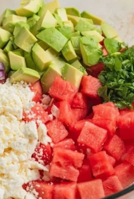 Fresh Watermelon Avocado Salad garnished with mint leaves