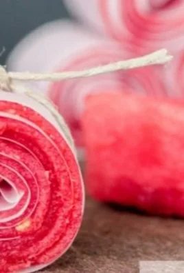Homemade watermelon fruit leather in a vibrant pink hue, showcasing a healthy snack option.
