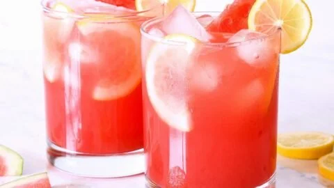 Refreshing watermelon lemonade served in a glass with a slice of lemon