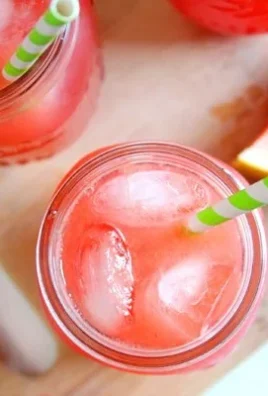 Refreshing glass of Watermelon Lemonade with mint leaves and ice cubes