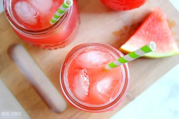 Refreshing glass of Watermelon Lemonade with mint leaves and ice cubes