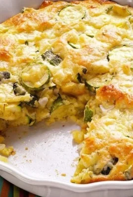 Homemade zucchini pie with fresh ingredients in a golden crust
