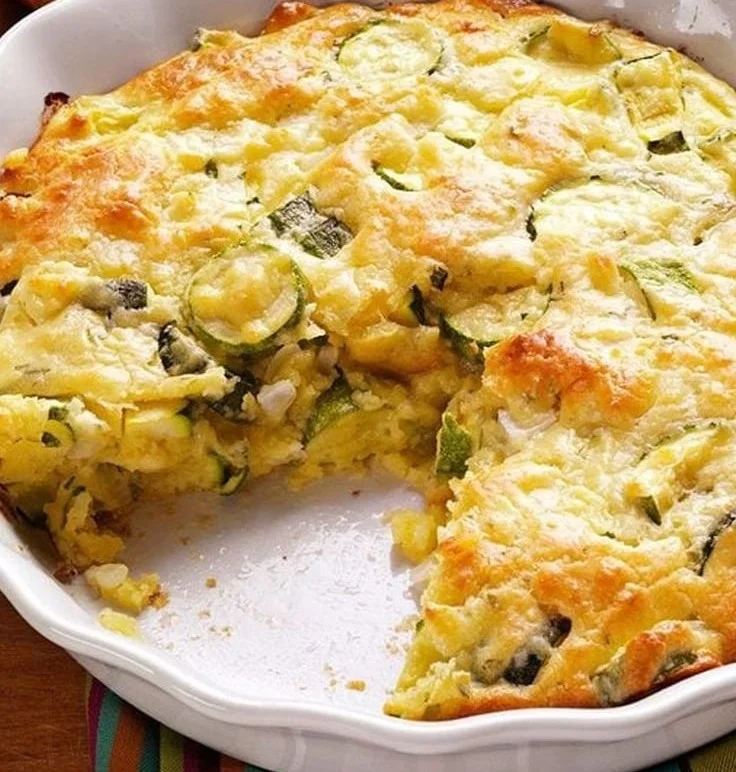 Homemade zucchini pie with fresh ingredients in a golden crust
